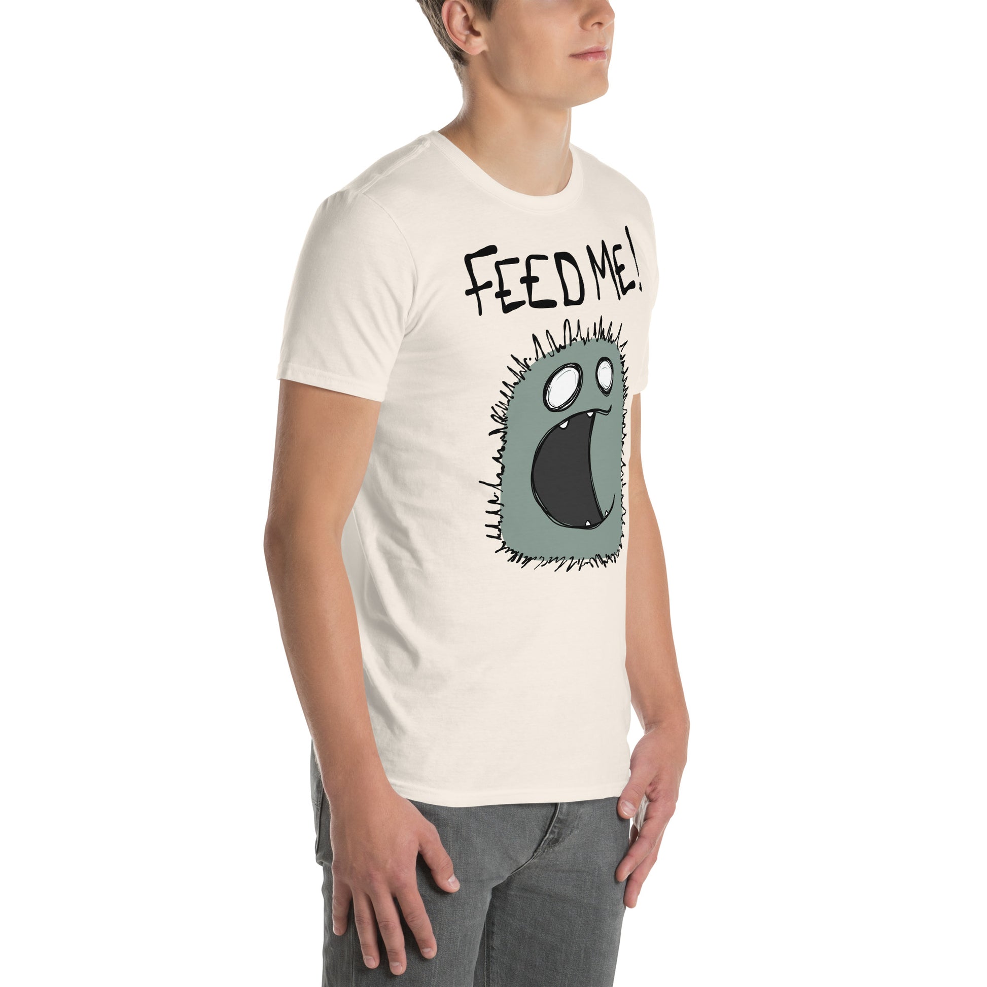 Person wearing a t-shirt with a cartoon character and 'FEED ME!' text on a white background