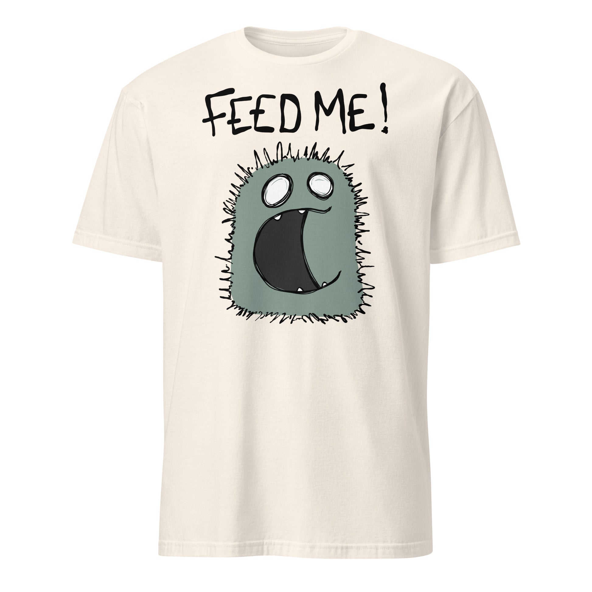 Beige t-shirt with a cartoon character and 'FEED ME!' text on a white background