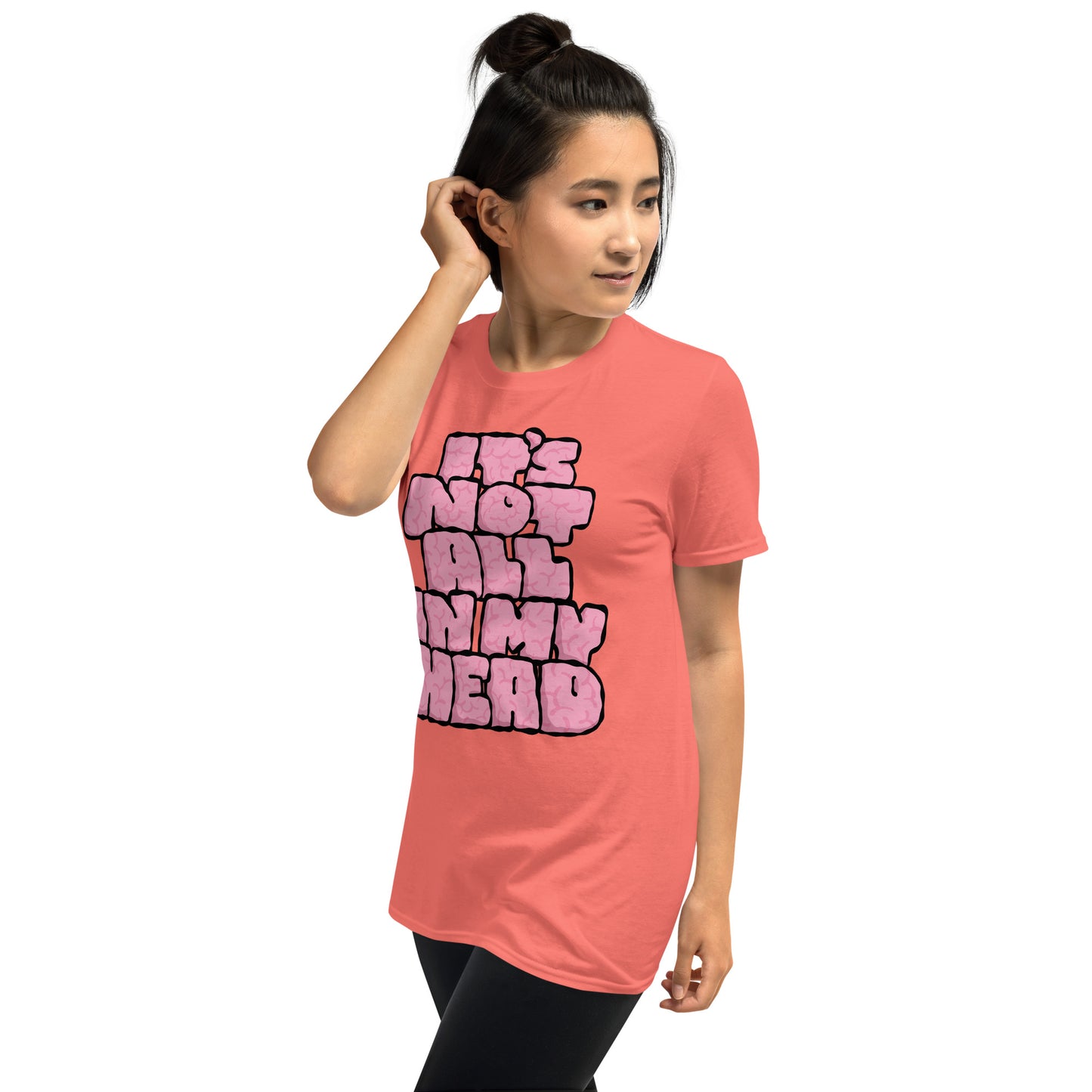 Person wearing a pink t-shirt with text IT'S NOT ALL IN MY HEAD on a white background