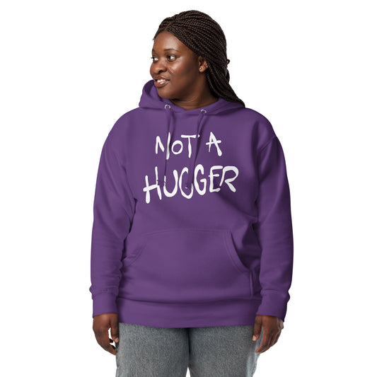 Person wearing a purple hoodie with 'NOT A HUGGER' text on a white background