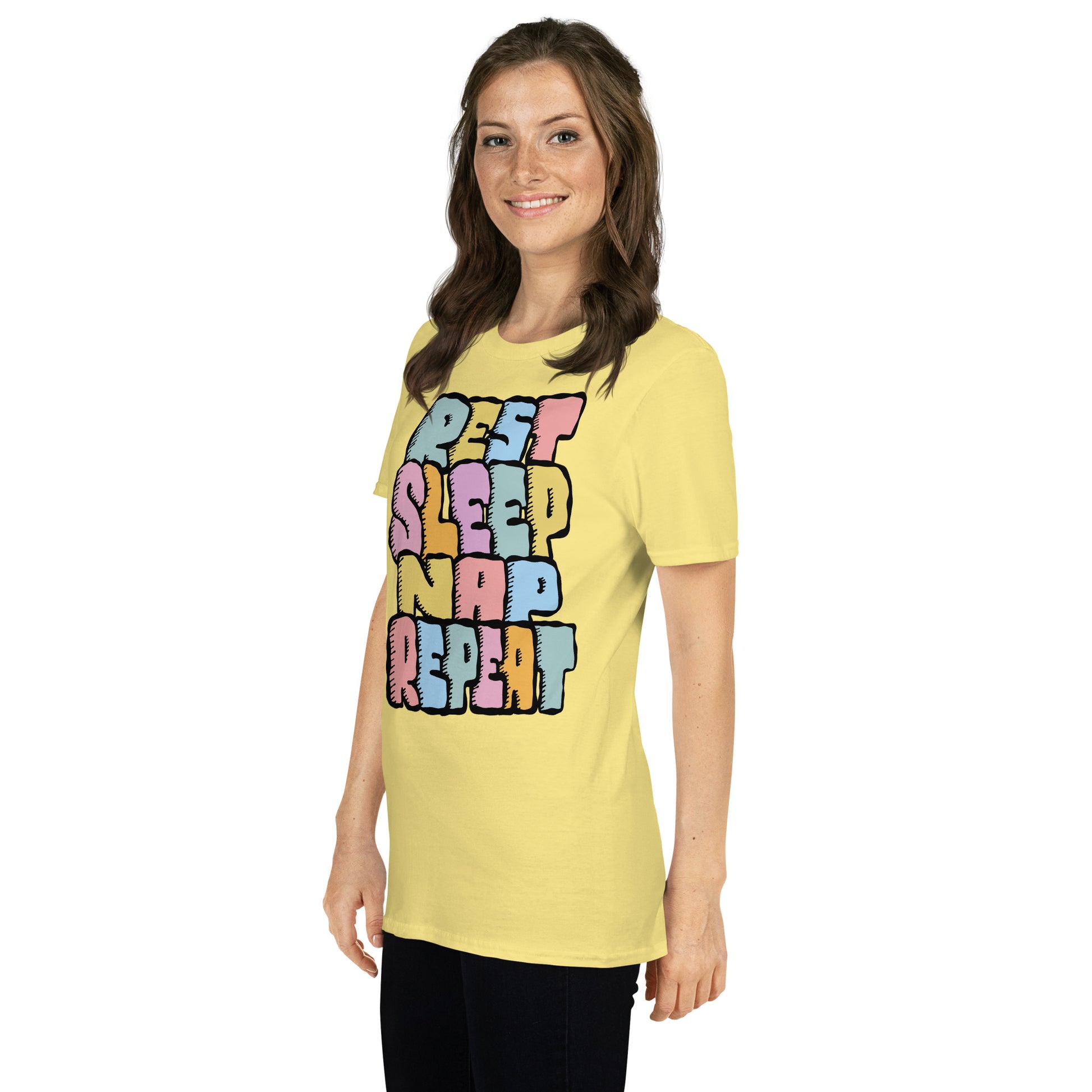 A woman wearing a yellow t-shirt with colourful text REST, SLEEP, NAP, REPEAT on a white background