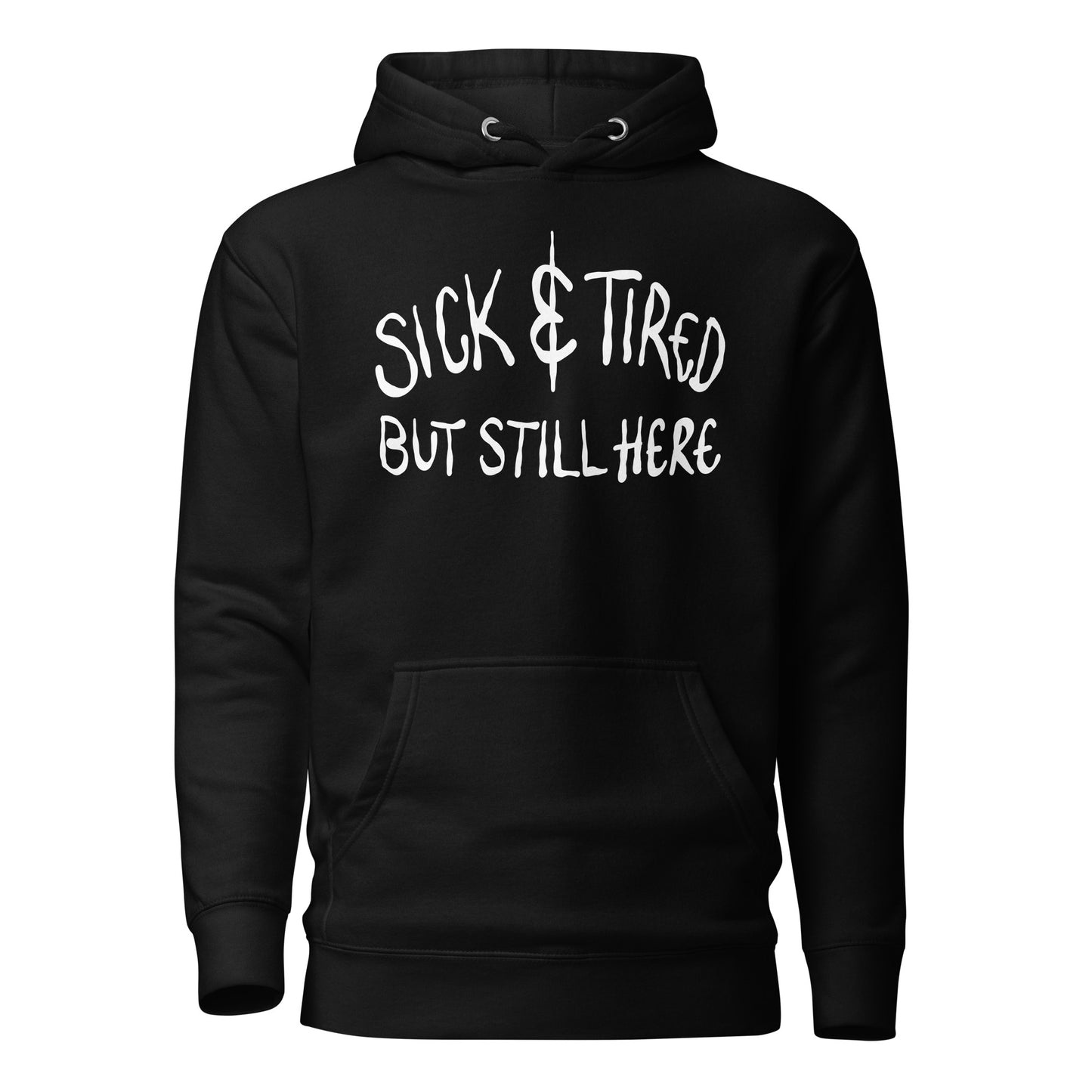 Black hoodie with white text 'SICK & TIRED BUT STILL HERE' on a white background