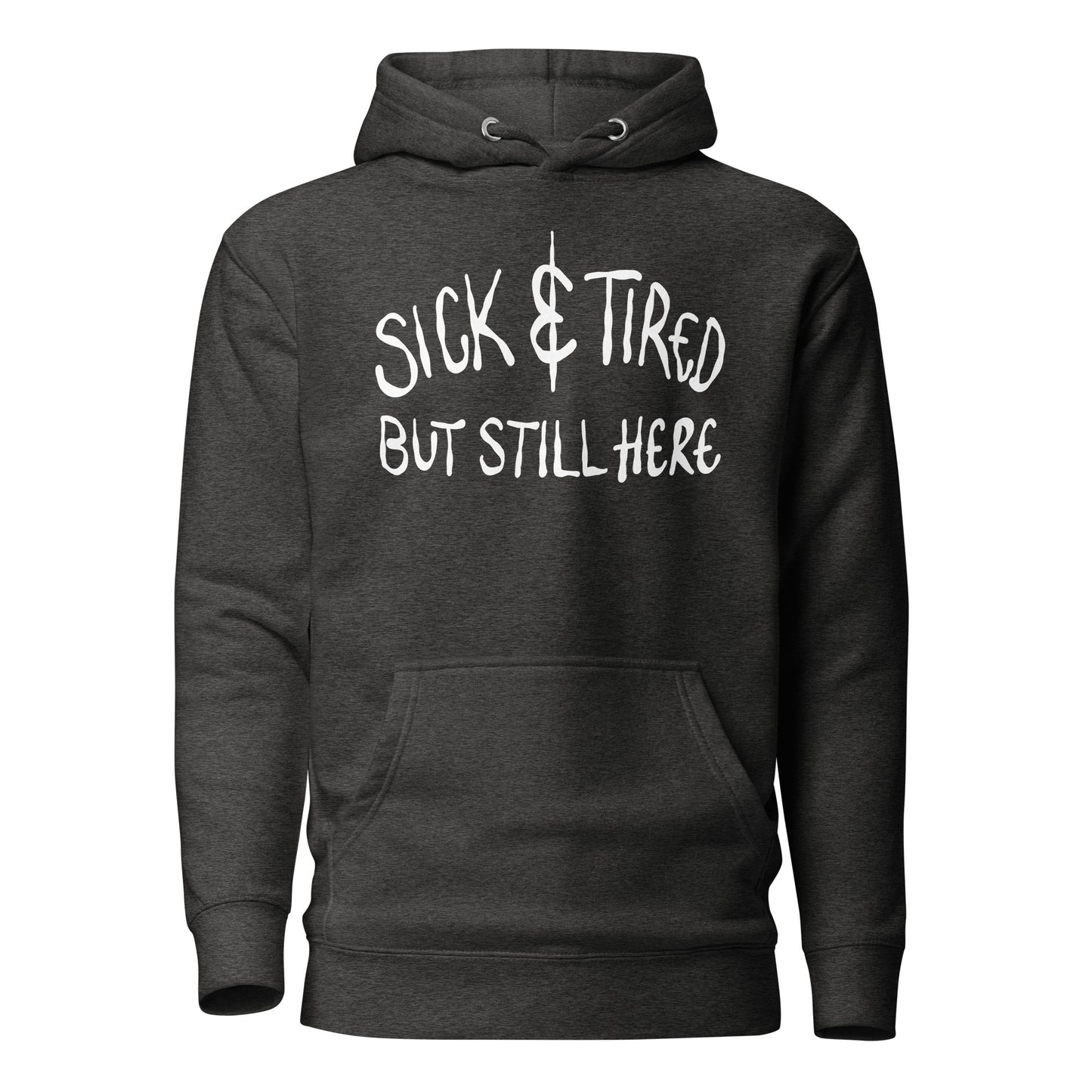 Black hoodie with white text 'SICK & TIRED BUT STILL HERE' on a white background
