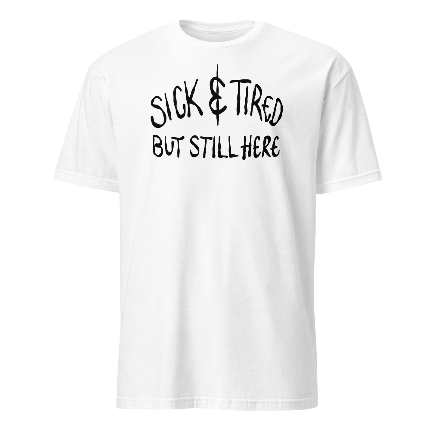 White t-shirt with black text 'SICK & TIRED BUT STILL HERE' on a white background