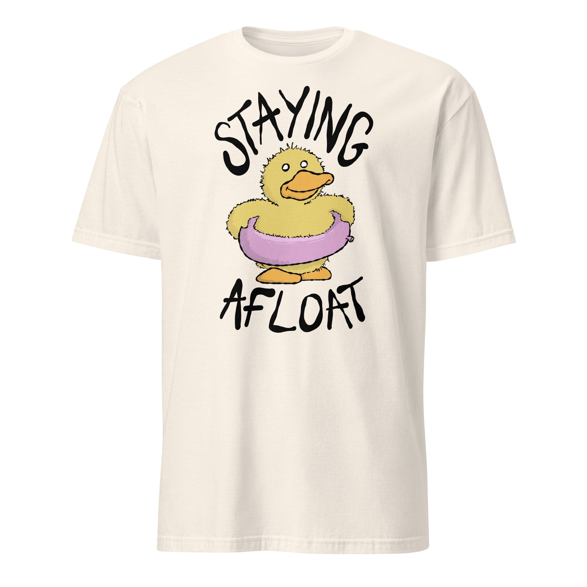 Beige t-shirt with a cartoon duck and text 'STAYING AFLOAT' on a white background