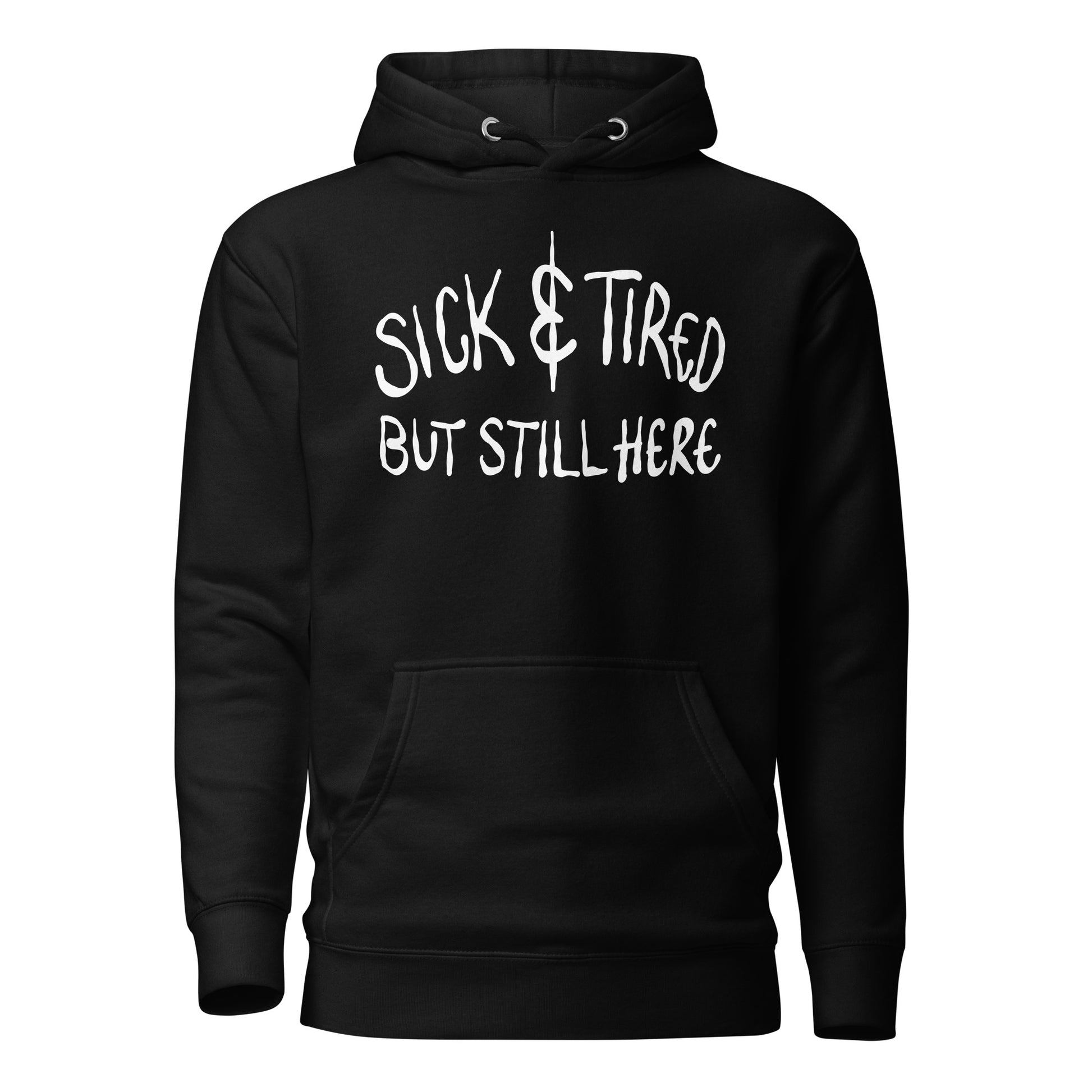 Black hoodie with white text 'SICK & TIRED BUT STILL HERE' on a white background